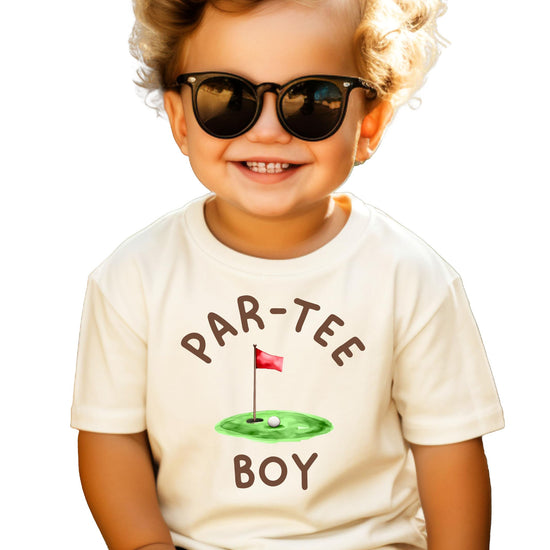 Close-up of Par-Tee Boy golf themed birthday graphic print on natural shirt