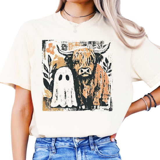 Women's spooky fall graphic tee with highland cow and ghost design, shown from alternate angle