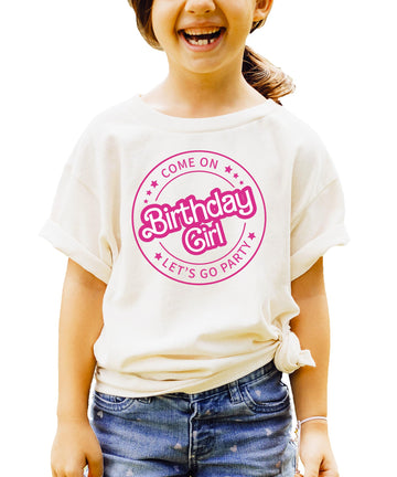 Pink retro graphic tee for kids reading Come On Birthday Girl Let's Go Party on a light background