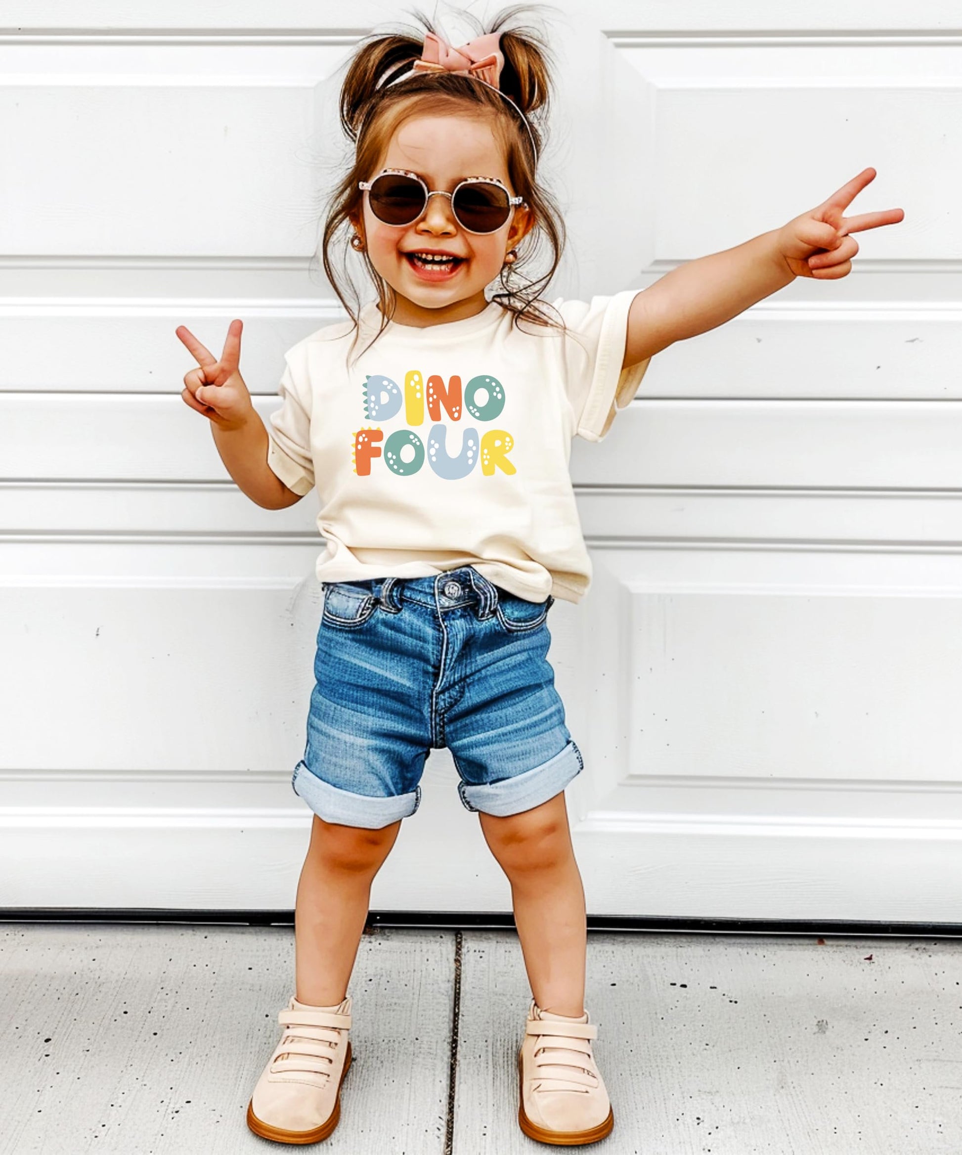 Dino Four birthday shirt displayed showing full front graphic print for boys and girls