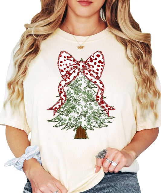 Women's holiday tee with faux glitter green floral Christmas tree and red polka dot coquette bow graphic