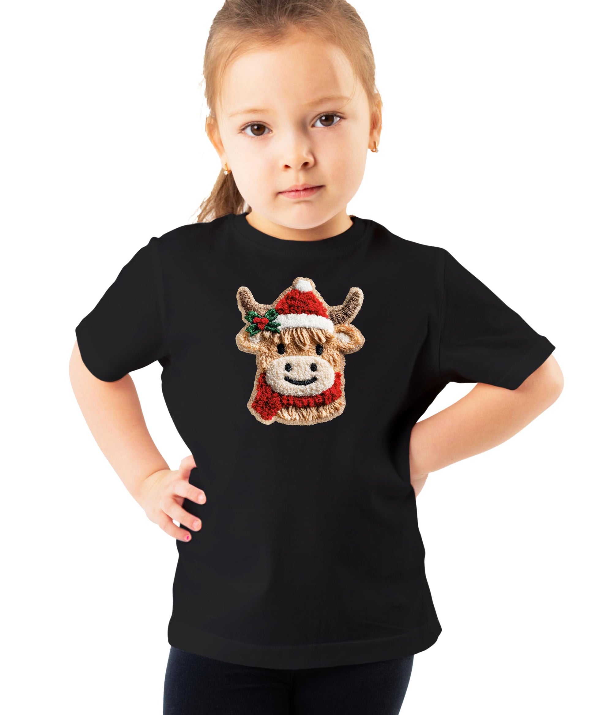 Flat lay of kids vintage red Christmas graphic tee with cow in Santa hat design