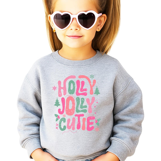 Front view of black toddler Christmas sweatshirt with colorful festive Holly Jolly Cutie design