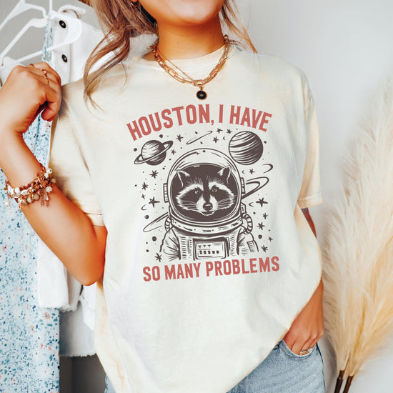 Full product view of funny space raccoon graphic tee showing fit and print quality