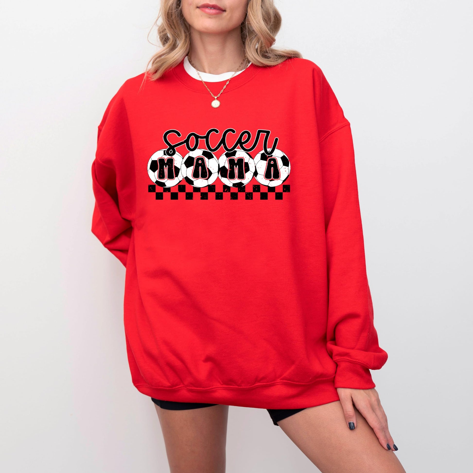 Side or lifestyle view of Olive Loves Apple Soccer Mama checkered sweatshirt for women
