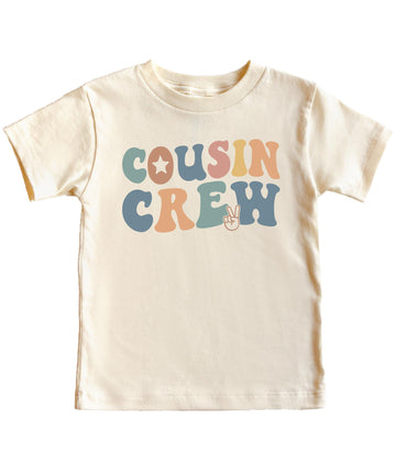 Flat lay of natural Cousin Crew youth tee showing full design and fit