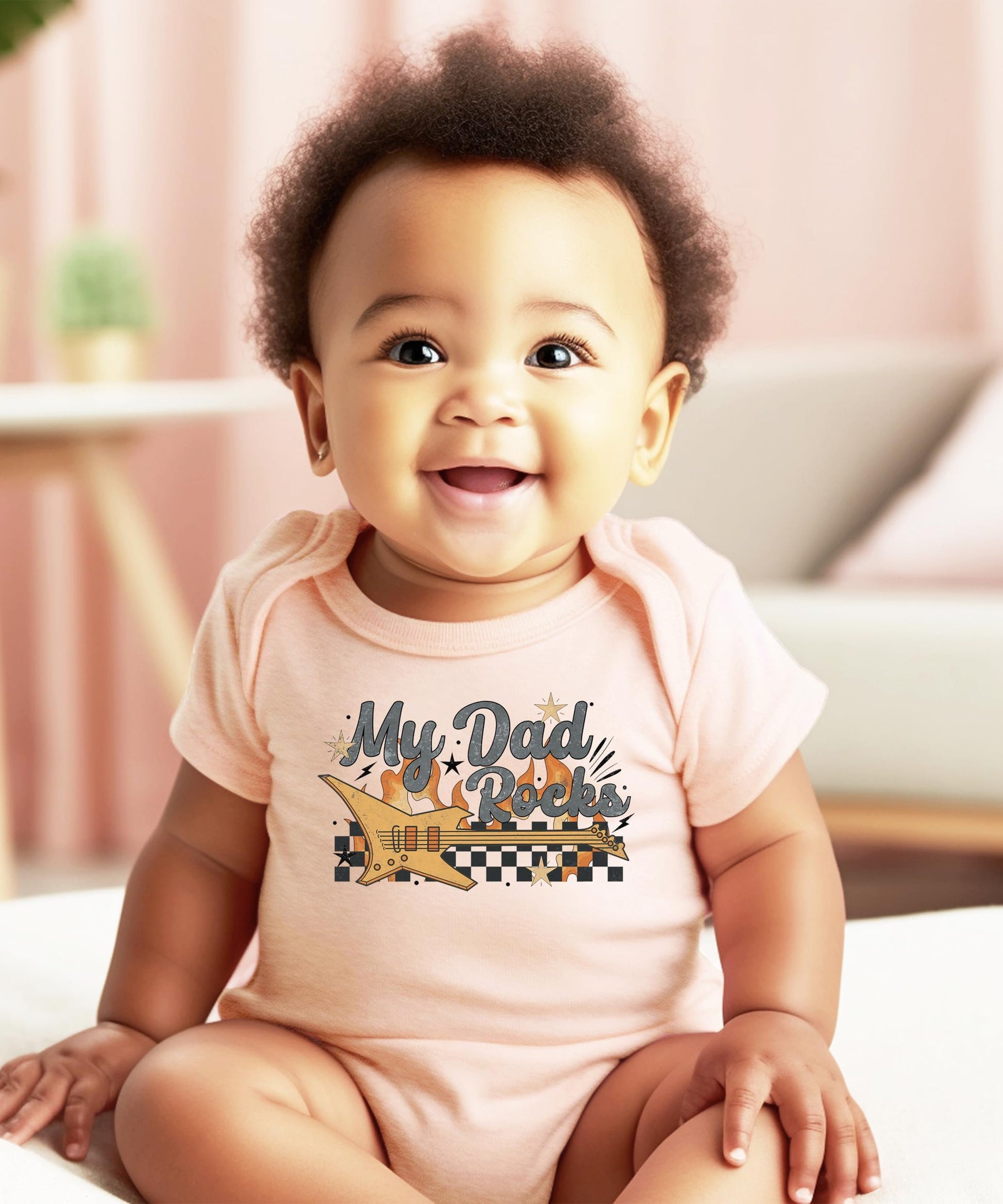 My Dad Rocks infant bodysuit shown folded highlighting retro rockstar guitar graphic