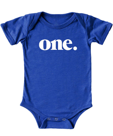 Close-up of Bold One graphic print on mauve baby bodysuit for first birthday