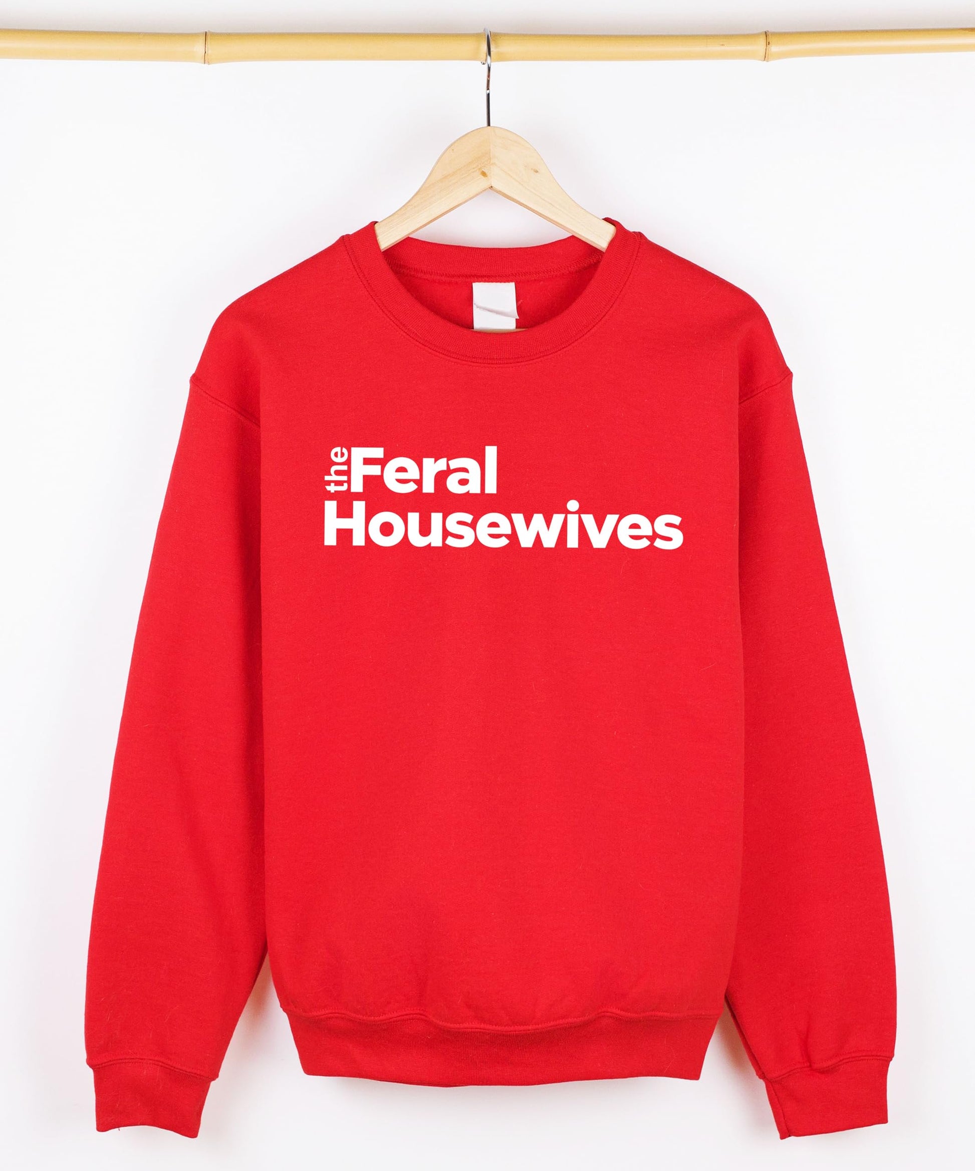 Detail shot of Feral Housewives sweatshirt print quality on gray fabric