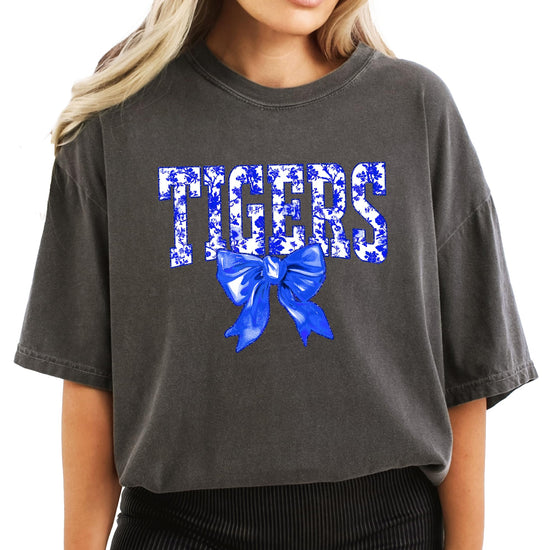 Close-up of Tigers floral graphic print with blue bow accent on women's tee