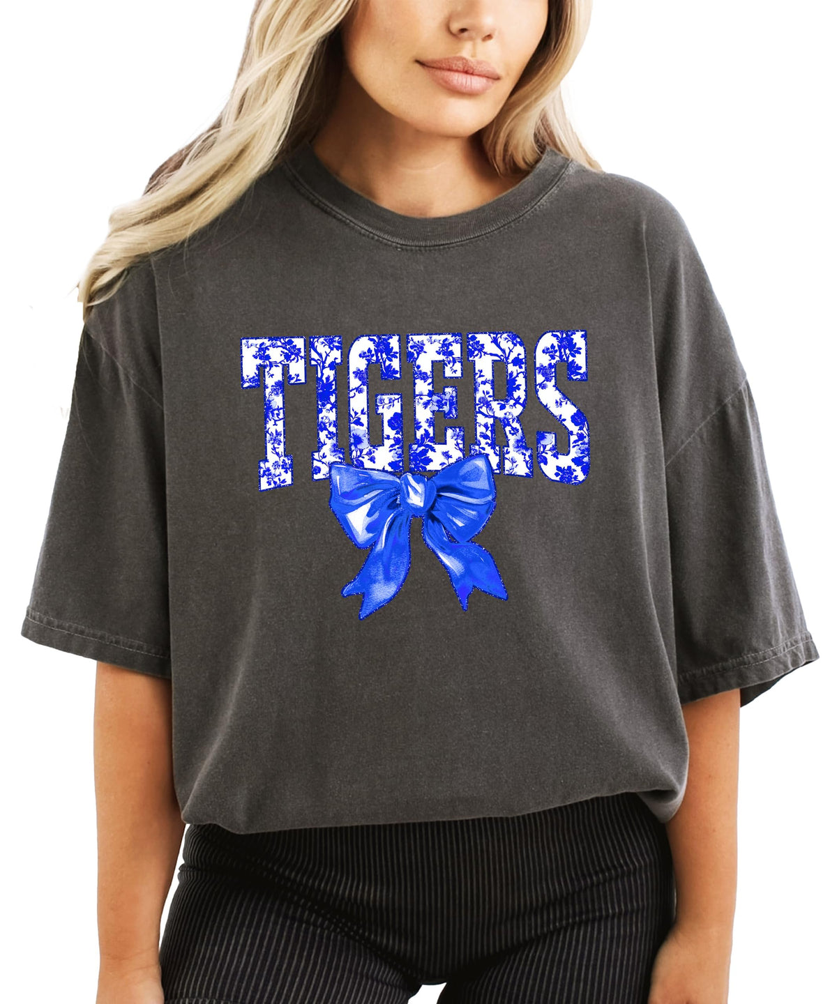 Close-up of Tigers floral graphic print with blue bow accent on women's tee