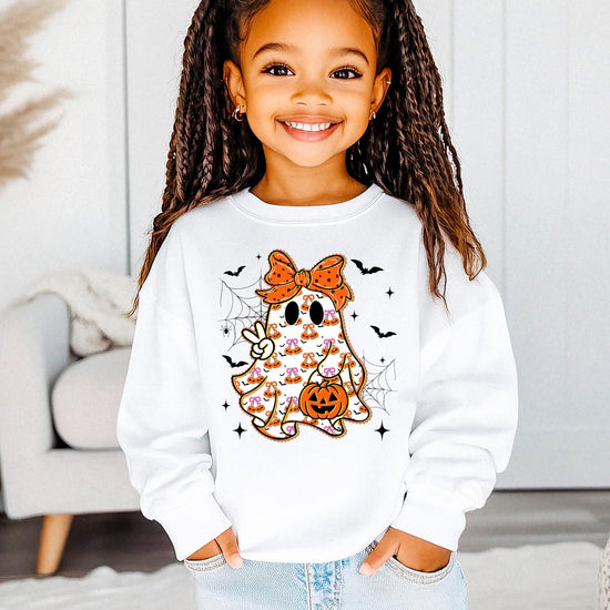 Flat lay of gray kids Halloween sweatshirt featuring cute ghost with orange bow design