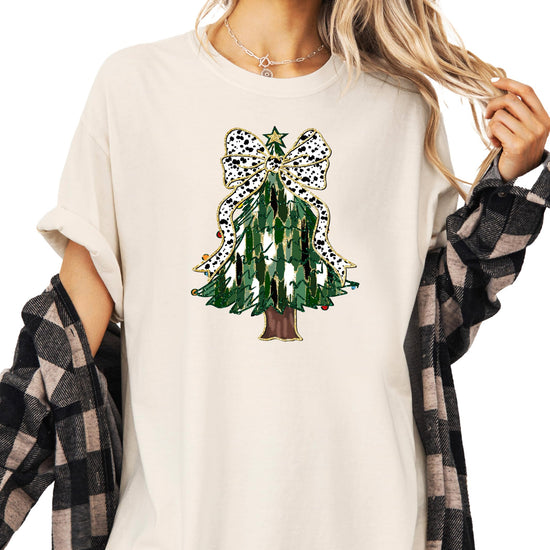 Front view of Christmas tree dalmatian bow holiday graphic tee on ivory shirt for women and teens