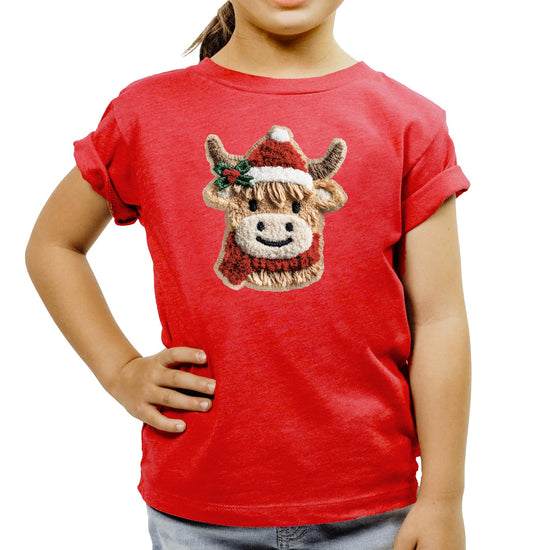 Full-length view of child wearing red cow Santa holiday graphic tee