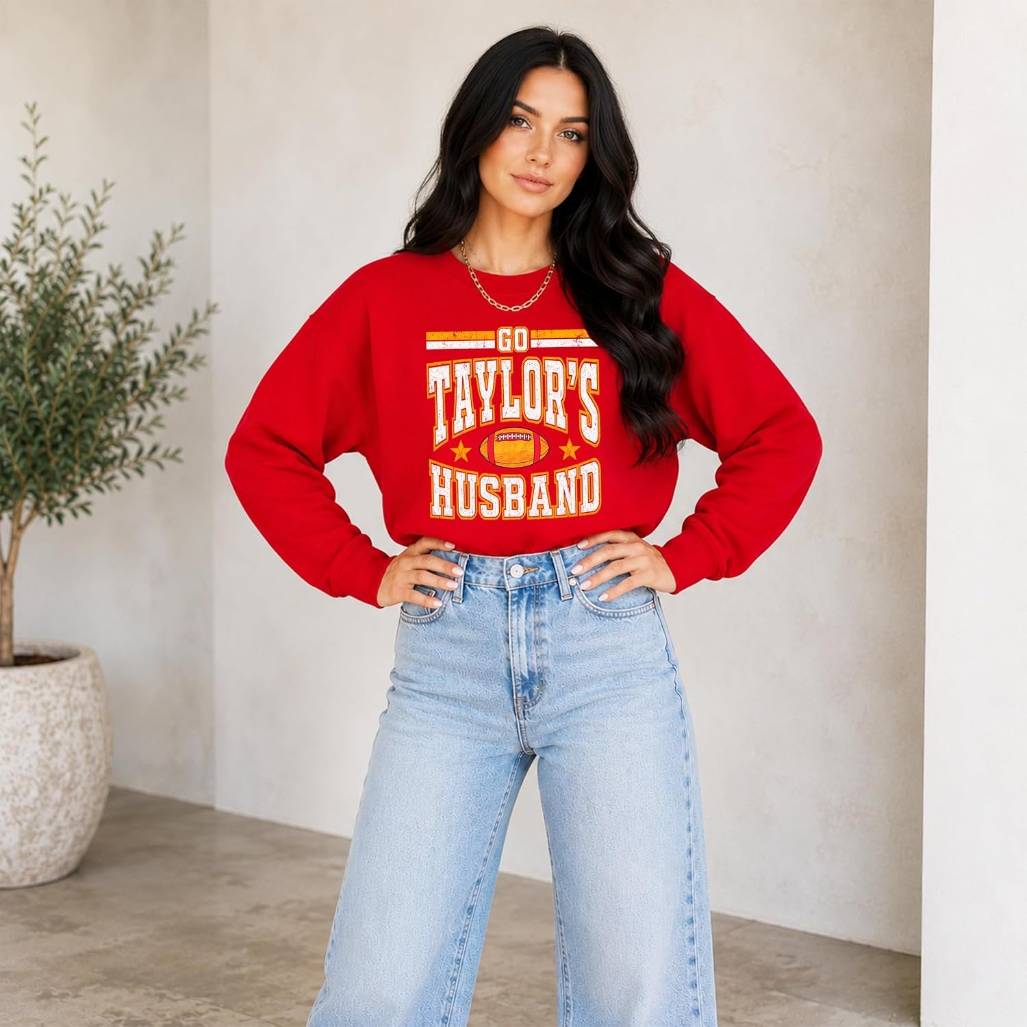 Flat lay of Go Taylor's Husband Swiftie football sweatshirt showing ribbed cuffs and hem detail