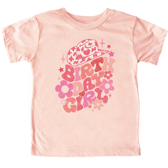 Close-up of groovy cowgirl birthday design on natural colored toddler tee