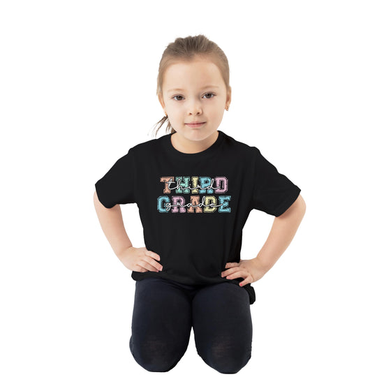 Close-up of colorful third grade text design on black youth t-shirt