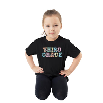 Close-up of colorful third grade text design on black youth t-shirt