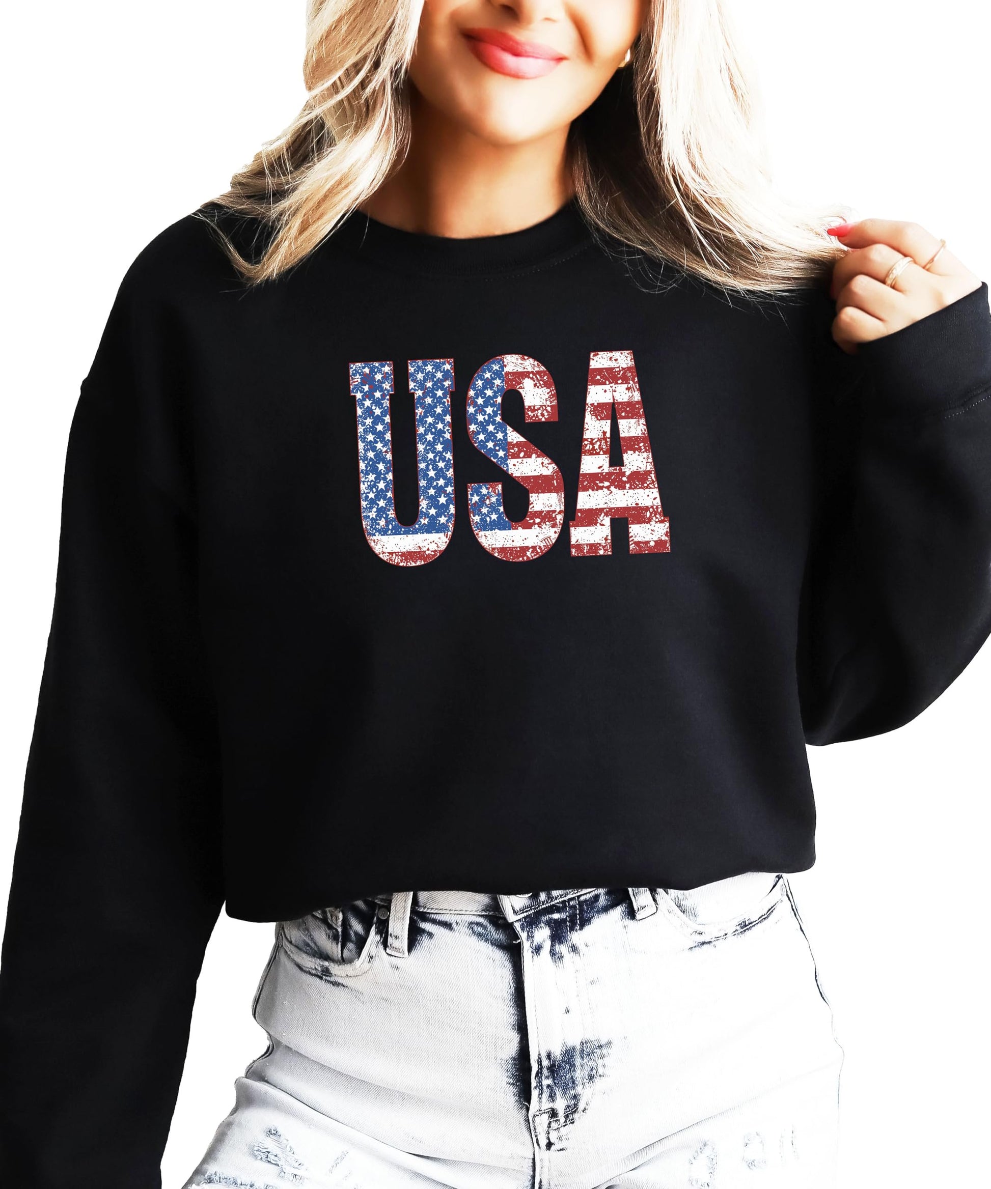 Black patriotic crewneck sweatshirt with vintage-style USA flag design, styled flat lay