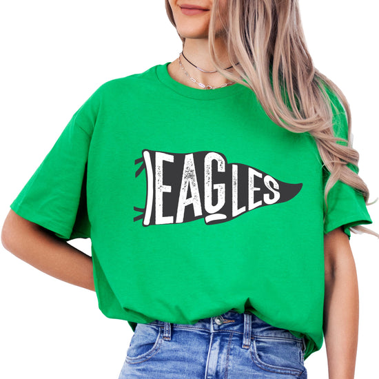 Close-up of vintage Eagles flag graphic design on green shirt