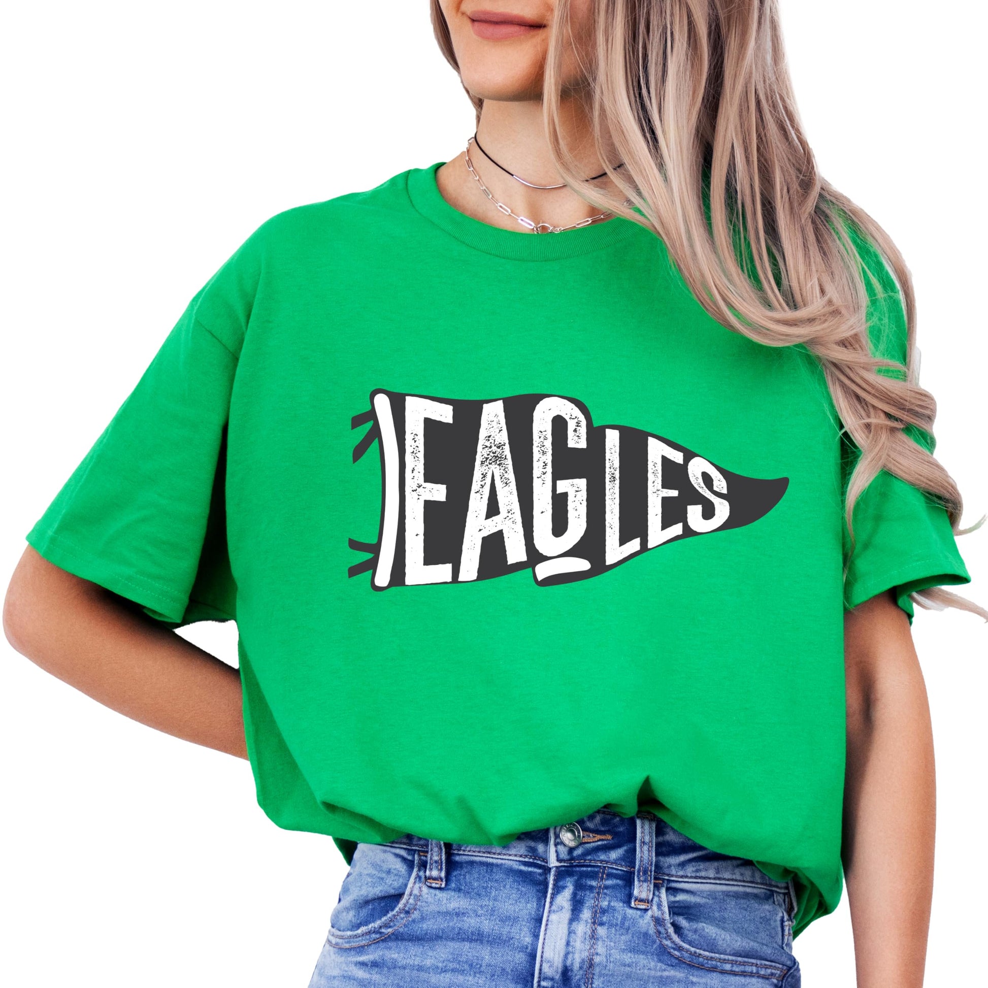 Close-up of vintage Eagles flag graphic design on green shirt