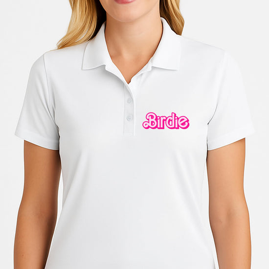 Pink golf polo shirt flat lay showing short sleeve version with girly birdie print