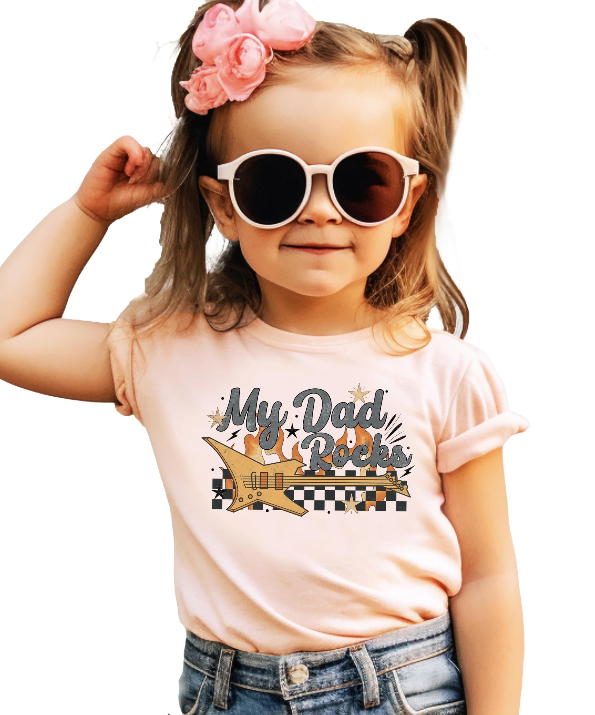 My Dad Rocks kids' graphic tee with electric guitar, flames, and checkered pattern on peach shirt