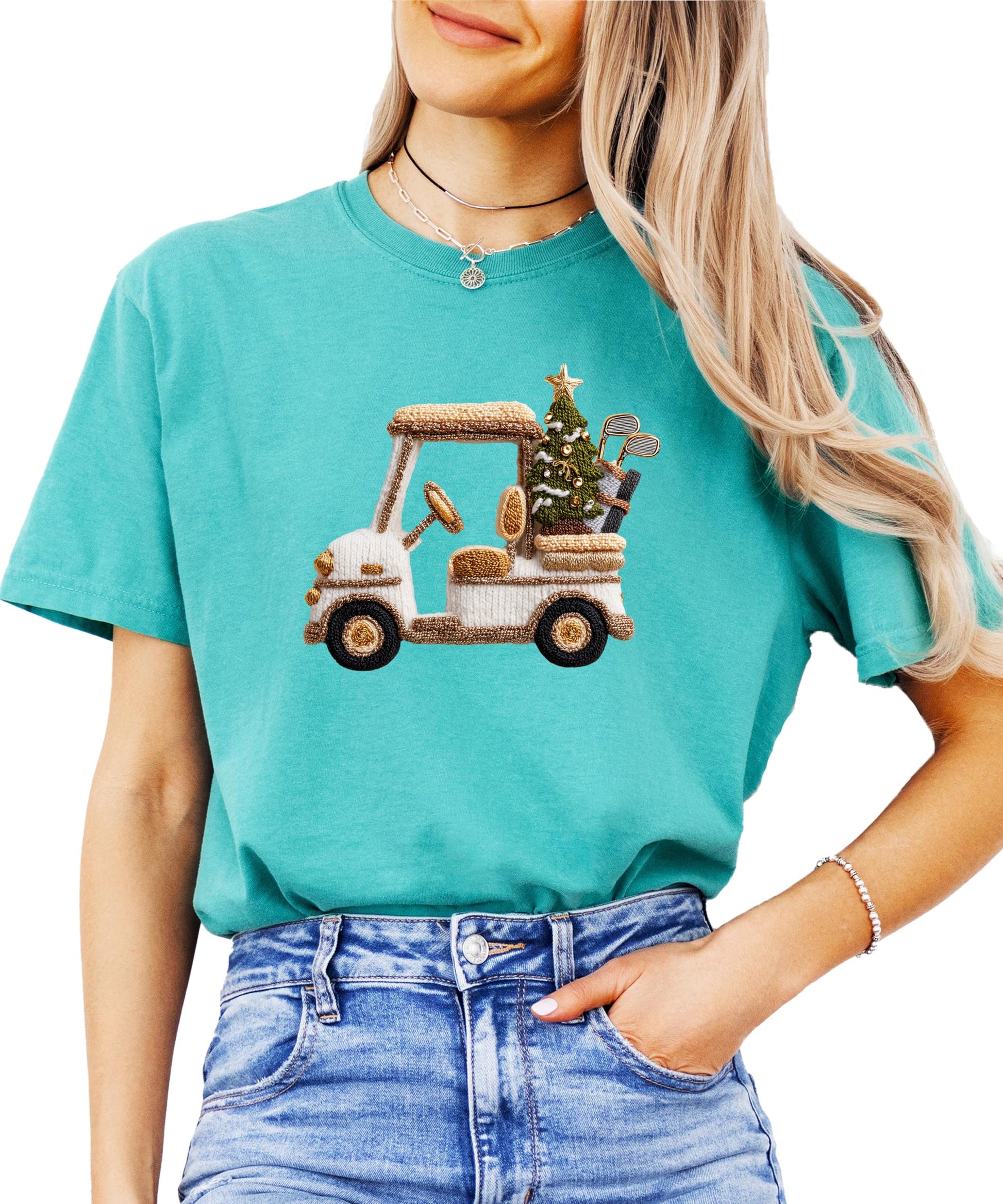 Close-up of ink-printed Christmas golf cart and holiday tree design on women's tee