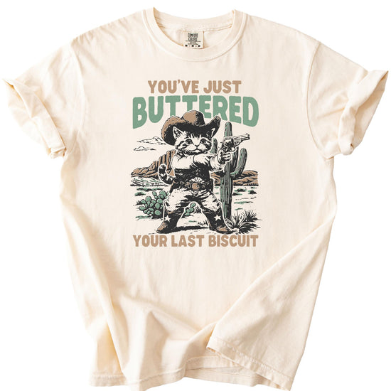 Detail shot of You've Buttered Your Last Biscuit Western cat graphic on women's shirt