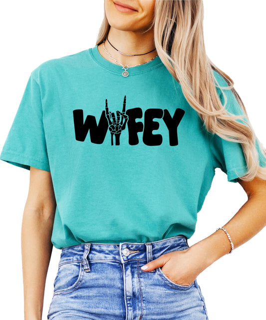 Close-up of Wifey skeleton hand graphic design on Halloween t-shirt