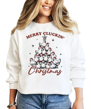 White women's pullover sweatshirt with a funny Merry Cluckin' Christmas chicken Santa hat Christmas tree graphic
