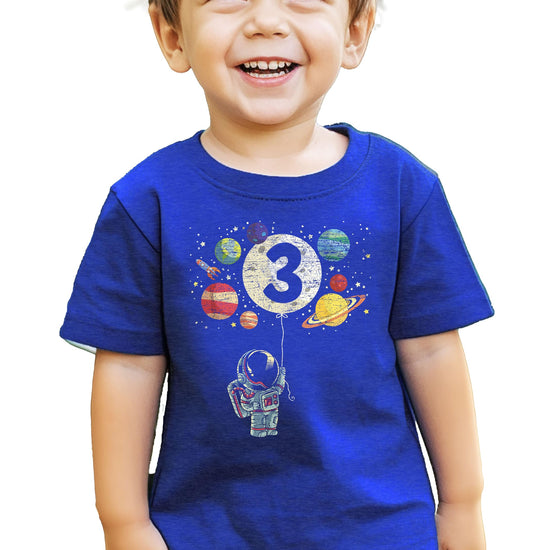Toddler wearing black space themed birthday t-shirt with rocket and planets