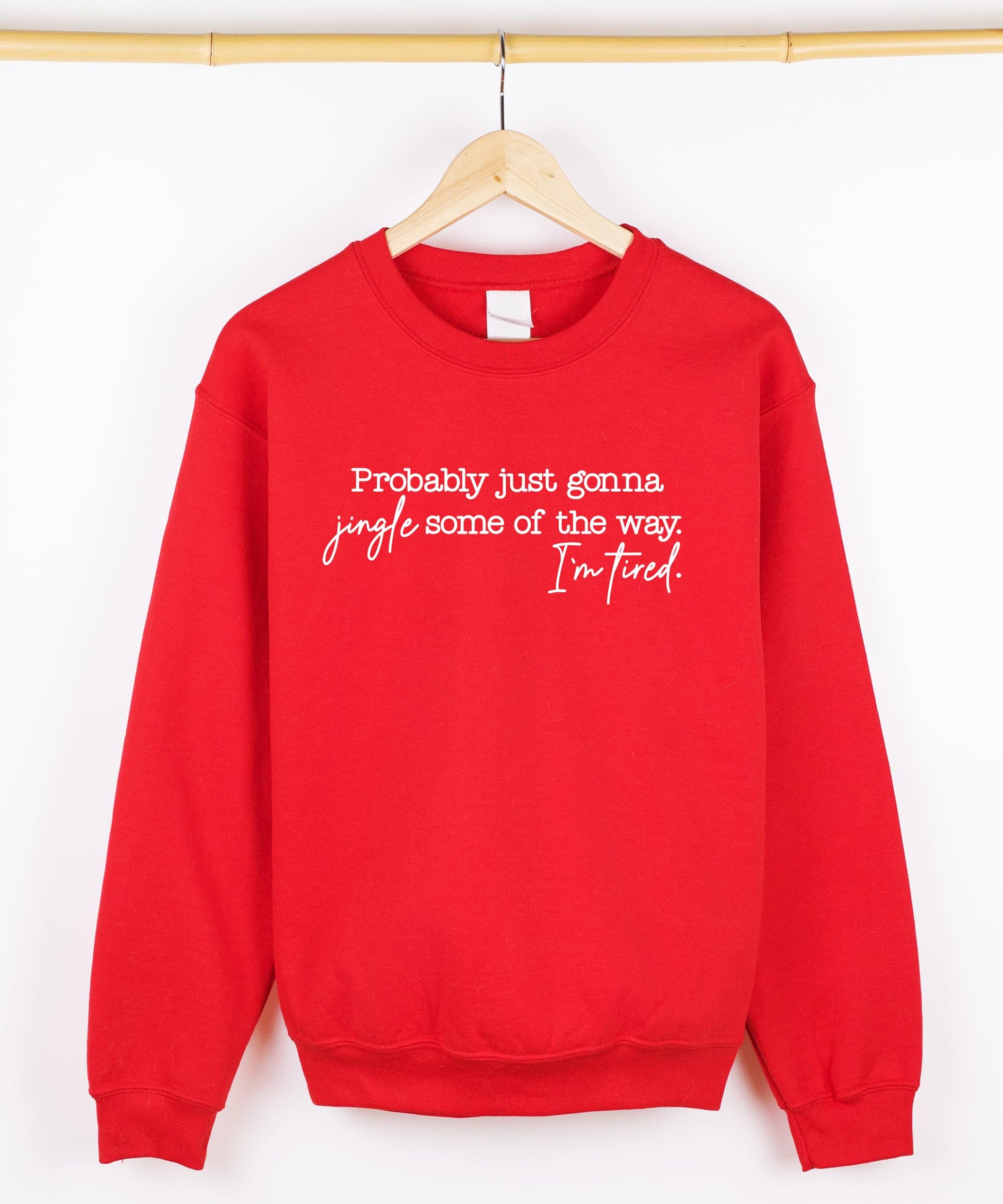 Detail shot of soft fleece fabric on red funny holiday sweatshirt for women