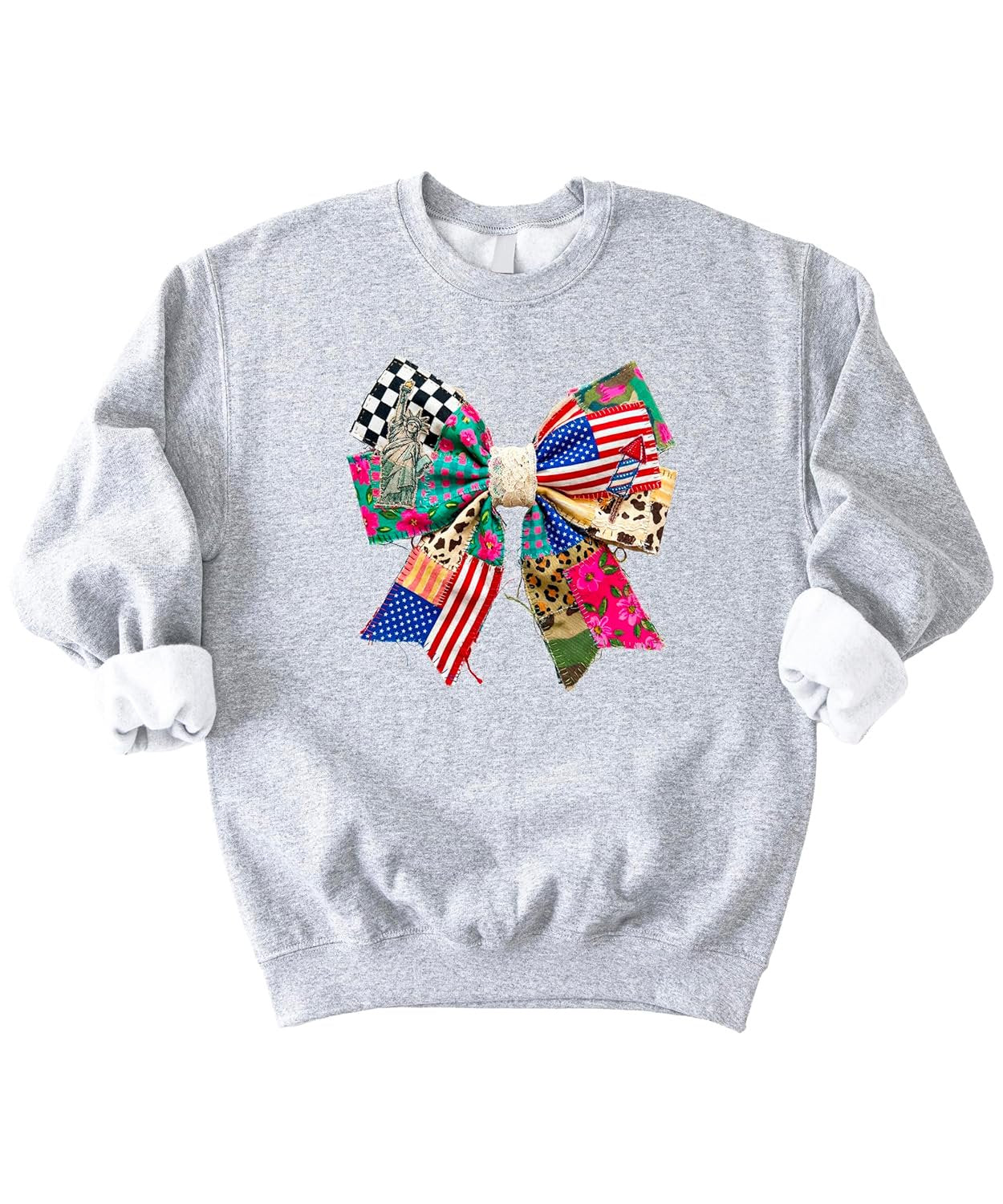 Close-up of coquette ribbon bow graphic on white sweatshirt with American flag, florals, and checkered patriotic print details