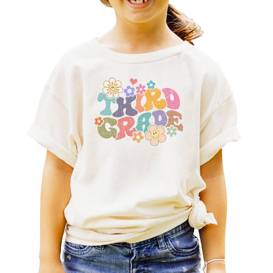 Front view of groovy daisy back to school shirt for girls entering third grade