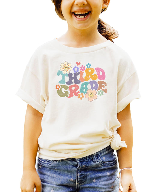 Front view of groovy daisy back to school shirt for girls entering third grade