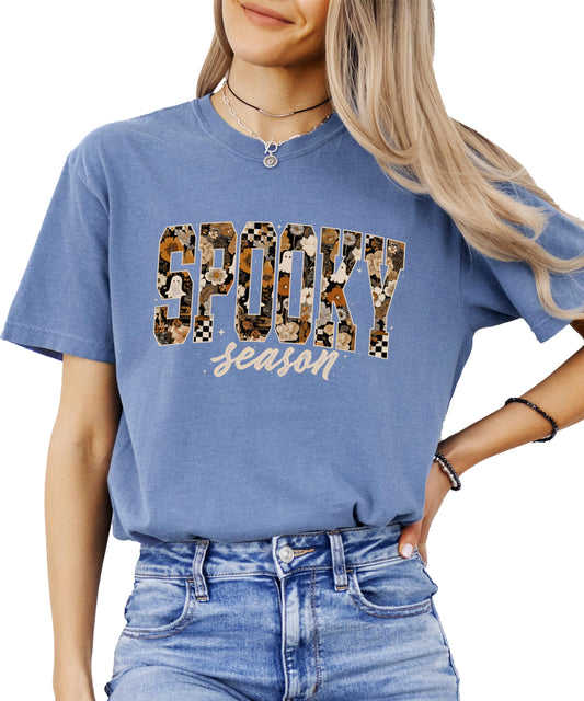 Close-up view of trendy Halloween tee featuring spooky season text with floral graphics