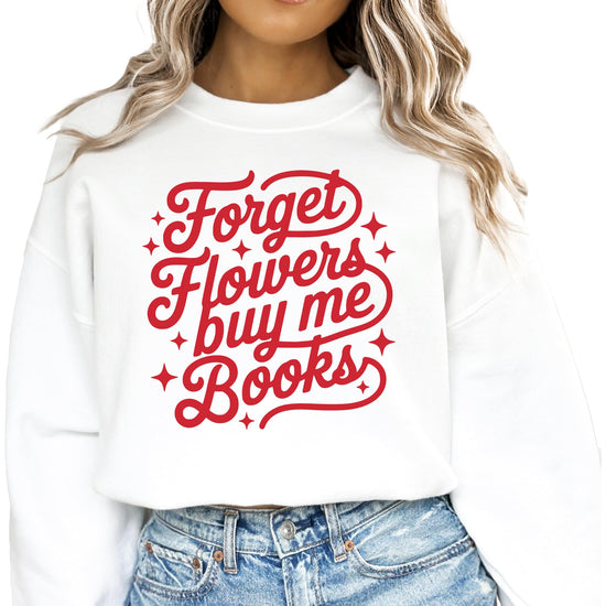 Close-up of 'Forget Flowers Buy Me Books' sweatshirt print detail on white fleece fabric