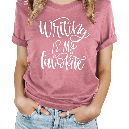 Close-up of handwritten-style Writing is My Favorite text design on shirt