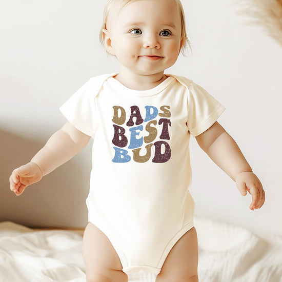 Dad's Best Bud snap-bottom baby bodysuit in earthy natural tones for newborns
