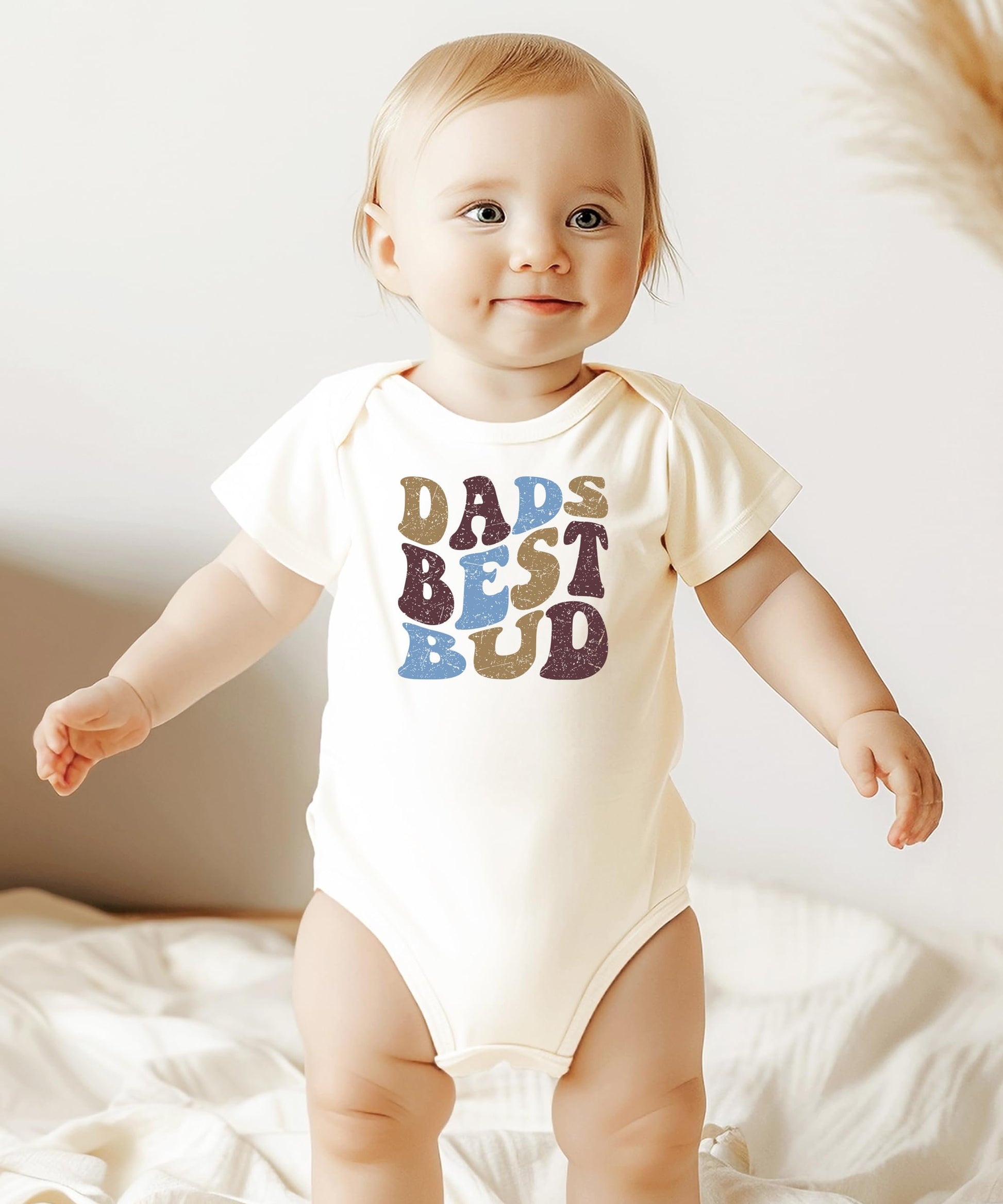 Dad's Best Bud snap-bottom baby bodysuit in earthy natural tones for newborns