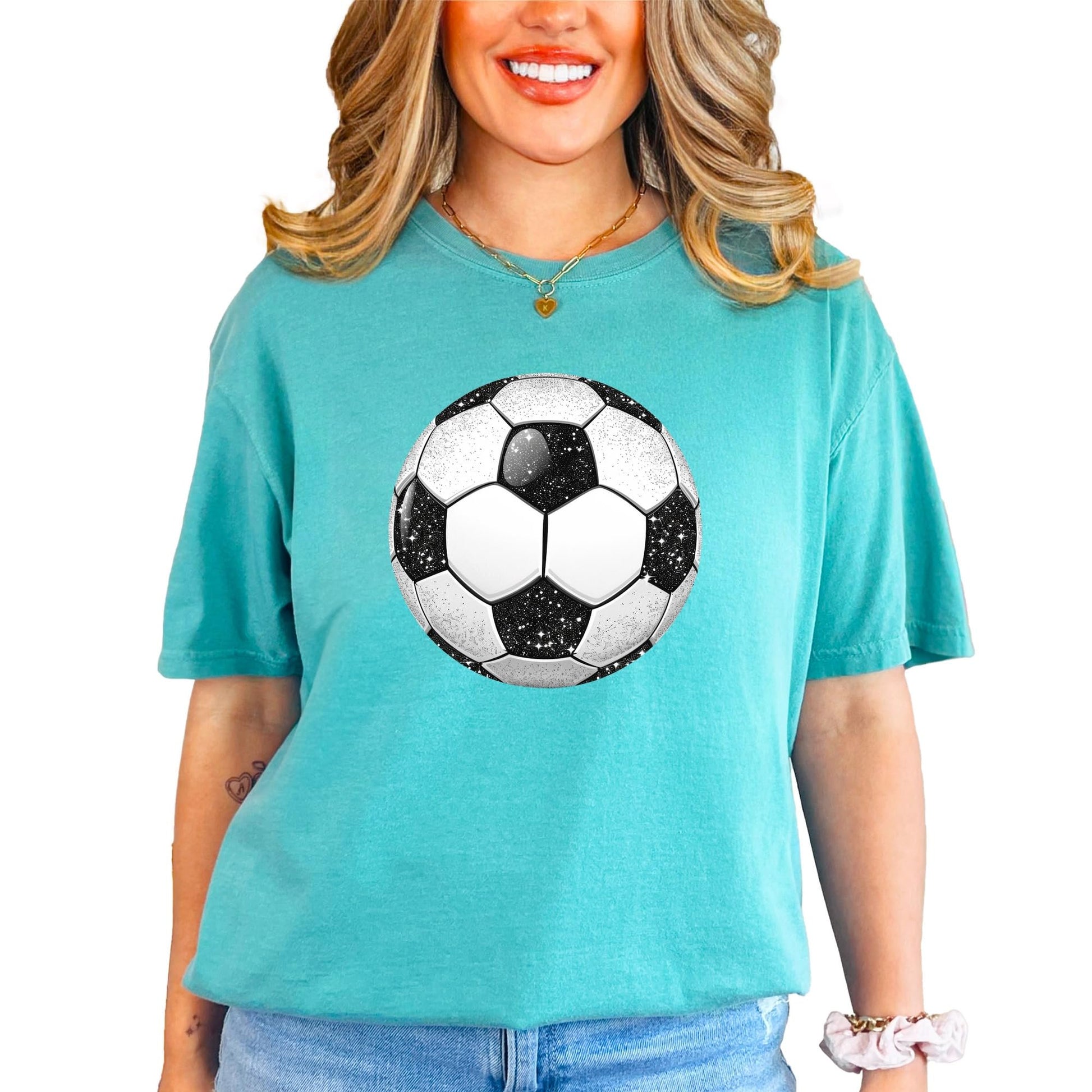 Women's soccer tee with glitter ball design styled for casual sporty look