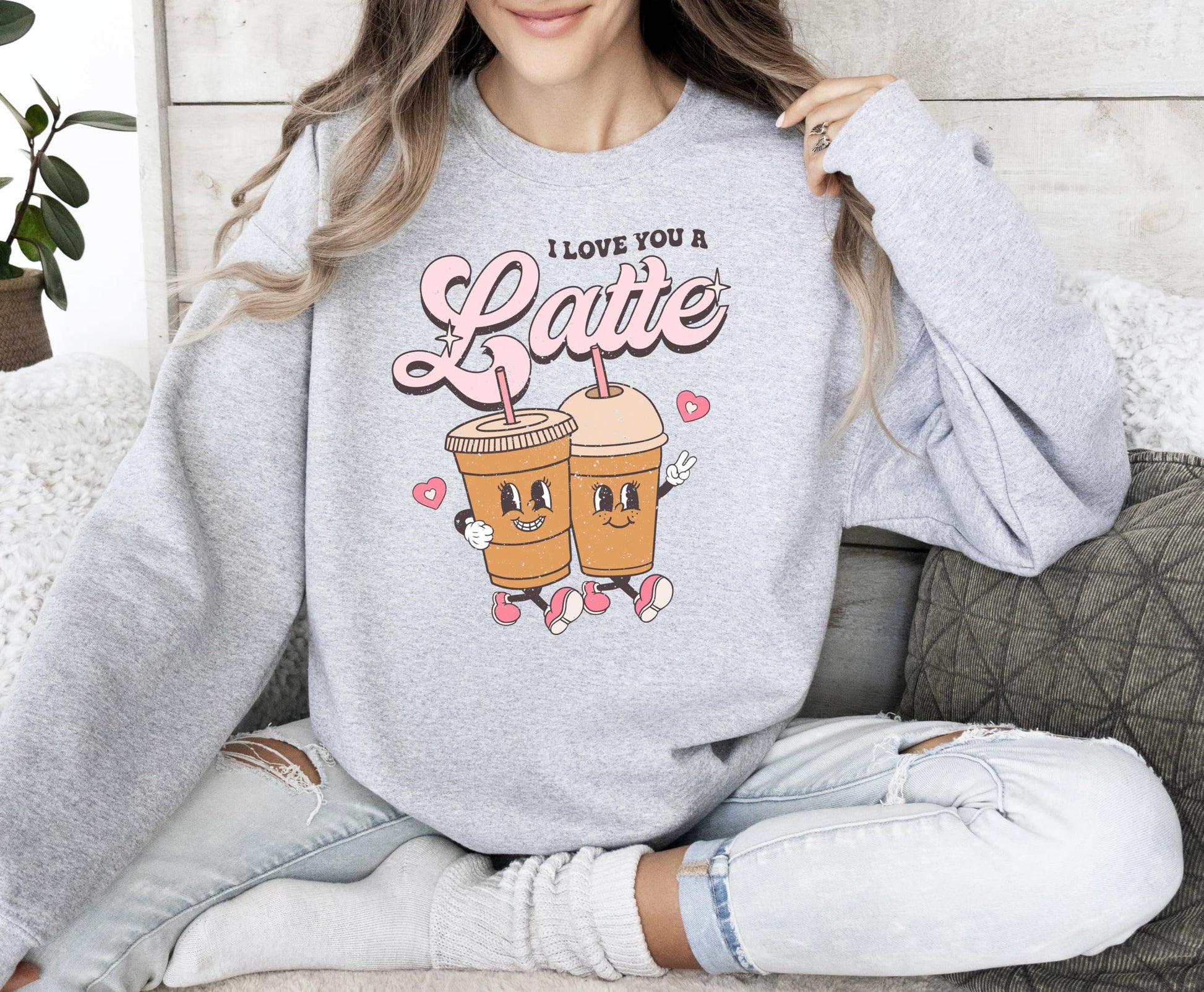 I Love You A Latte funny Valentine's sweatshirt lifestyle flat lay in gray