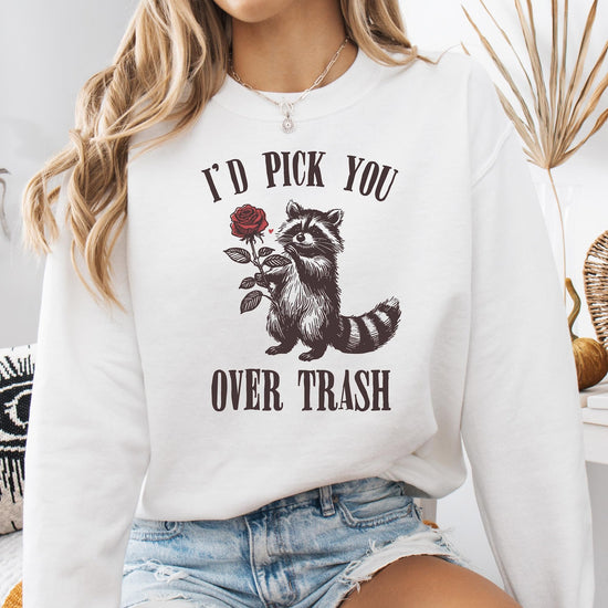Toddler or youth size white sweatshirt featuring 'I'd Pick You Over Trash' raccoon Valentine's graphic