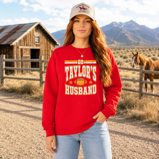 Go Taylor's Husband crewneck sweatshirt styled for a football watch party or tailgate