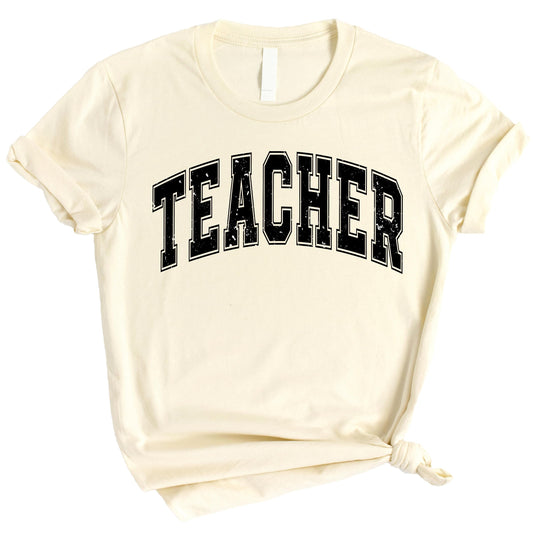 Black teacher varsity t-shirt with white collegiate lettering displayed on hanger
