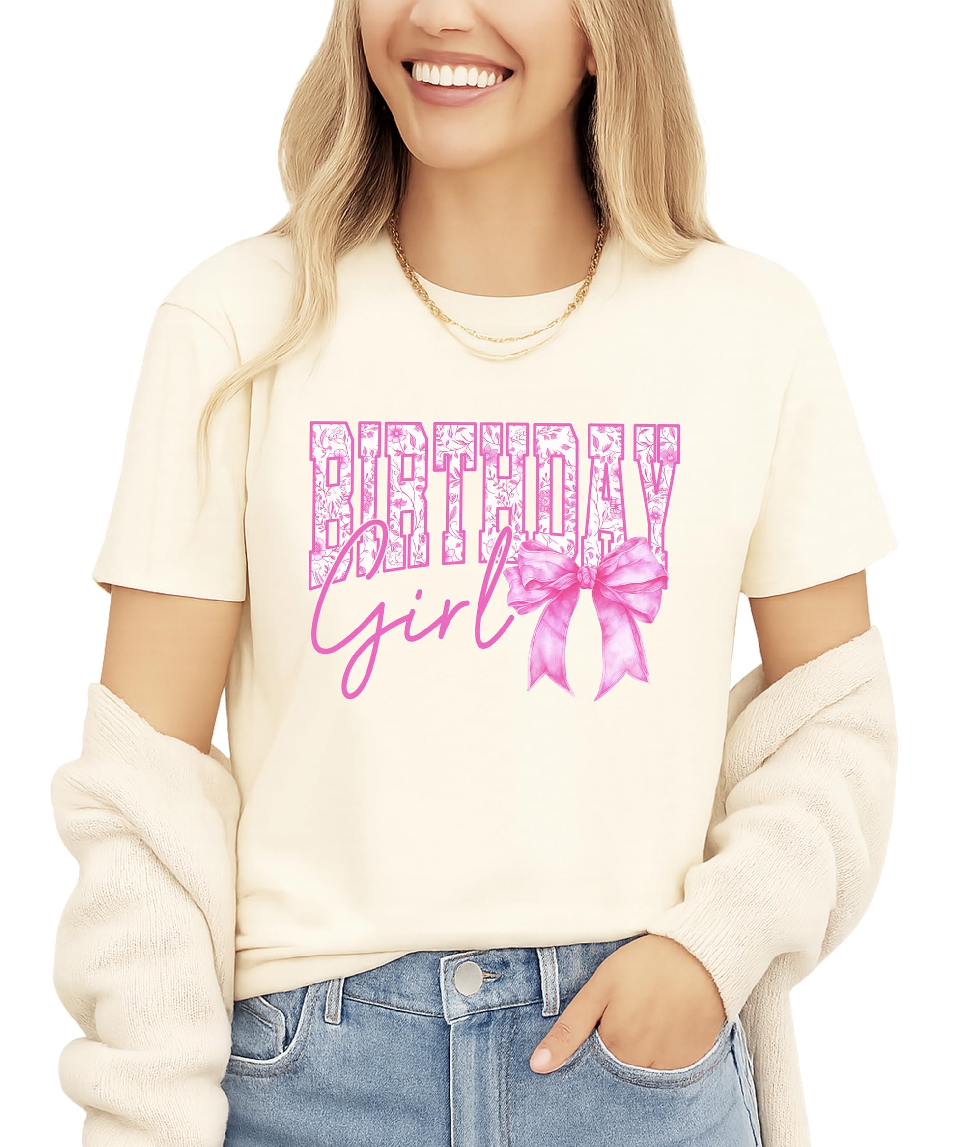 Close-up view of floral letter design and pink bow detail on birthday shirt