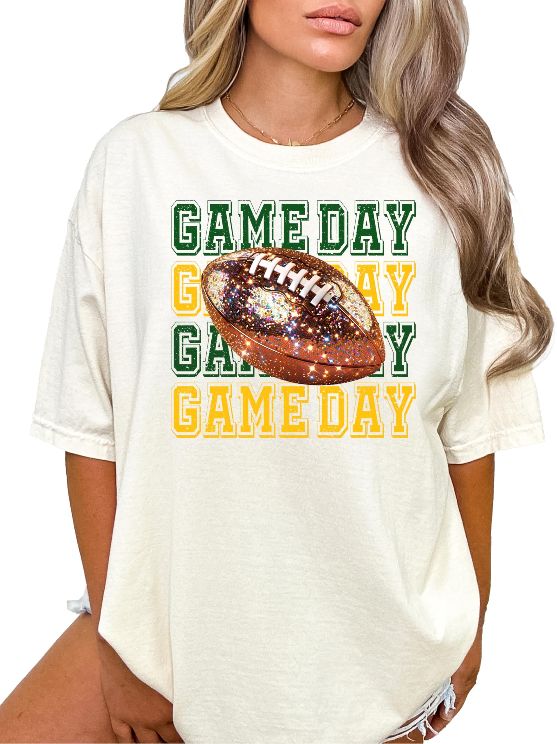Full-length view of women's game day football tee in ivory with green and yellow design