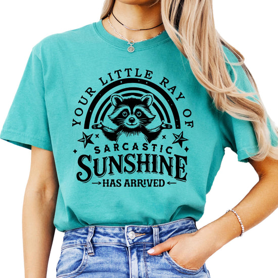 Woman wearing ivory graphic tee with raccoon sarcastic sunshine design lifestyle shot