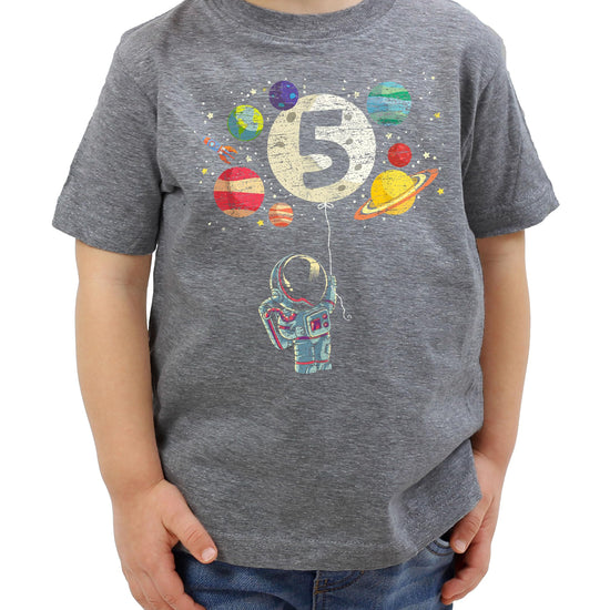 Child wearing vintage royal blue 5th birthday space themed astronaut t-shirt